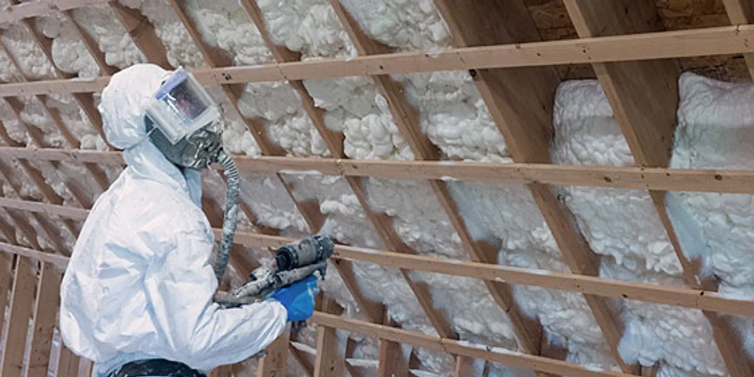 Metal building insulated with spray foam
